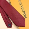 Burgundy silk tie with tonal geometric micro-pattern and textured finish