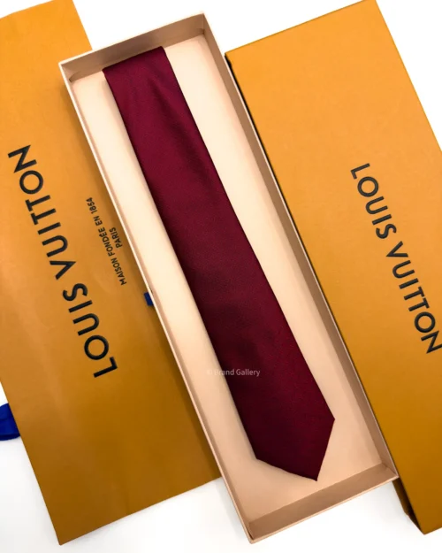 Burgundy silk tie with tonal geometric micro-pattern and textured finish