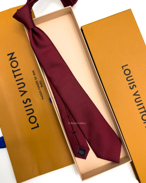 Burgundy silk tie with tonal geometric micro-pattern and textured finish