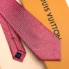 Raspberry red silk tie with repeating pink and white geometric pattern
