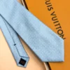 Sky blue silk tie with repeating white geometric micro-pattern