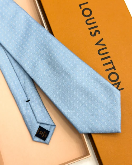 Sky blue silk tie with repeating white geometric micro-pattern