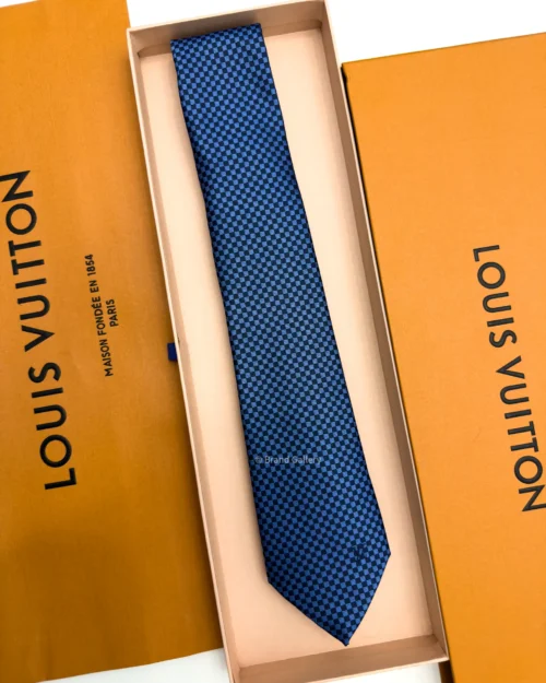 Blue Micro Damier silk tie with navy and bright blue geometric check pattern