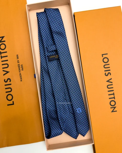 Blue Micro Damier silk tie with navy and bright blue geometric check pattern