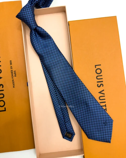 Blue Micro Damier silk tie with navy and bright blue geometric check pattern