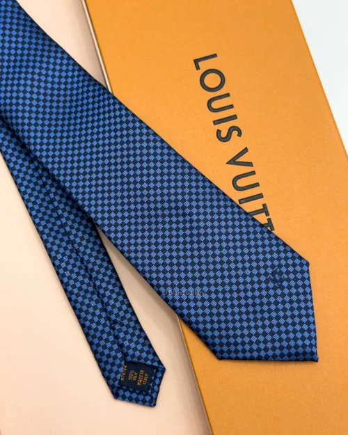 Blue Micro Damier silk tie with navy and bright blue geometric check pattern