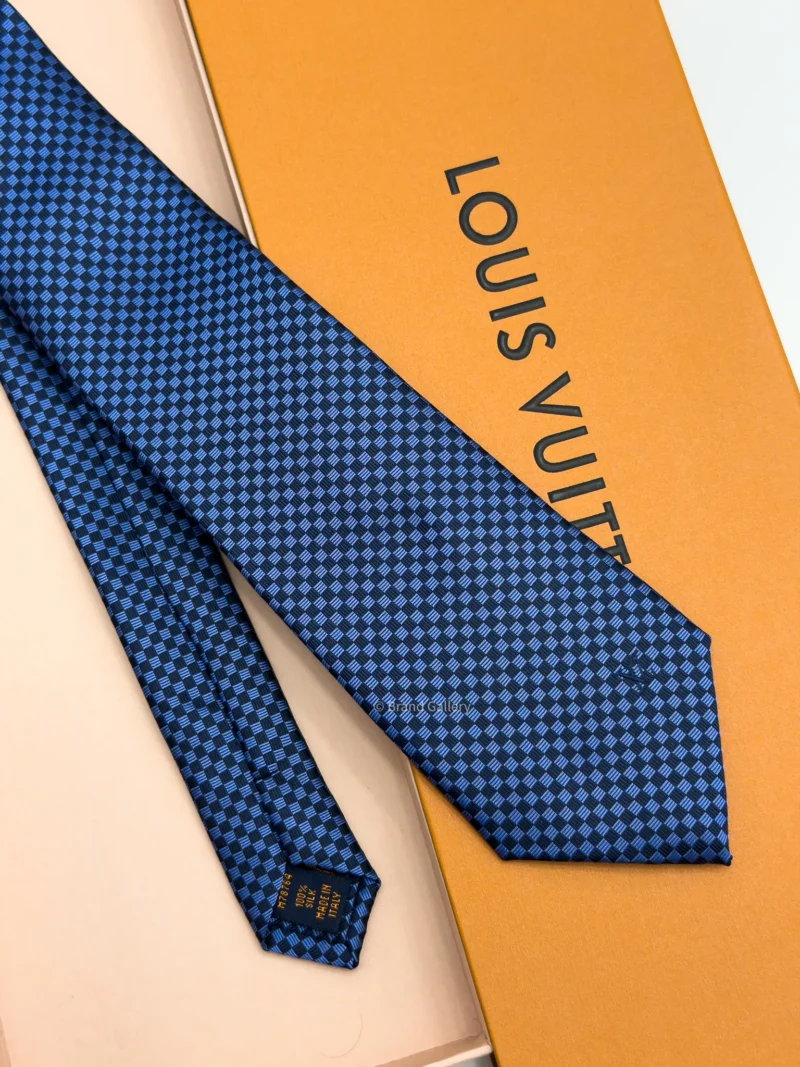 Blue Micro Damier silk tie with navy and bright blue geometric check pattern